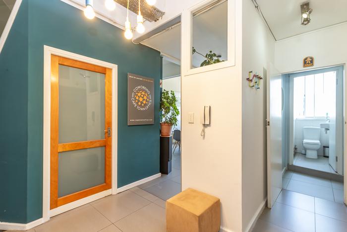 Meeting room with TV screen and whiteboard at Cape Town Office