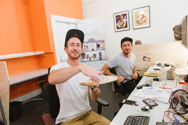 Members sharing a laugh at their desks, 2016