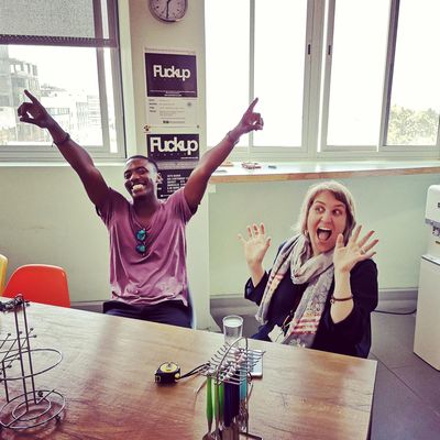 Two members celebrating at Cape Town Office, 2018