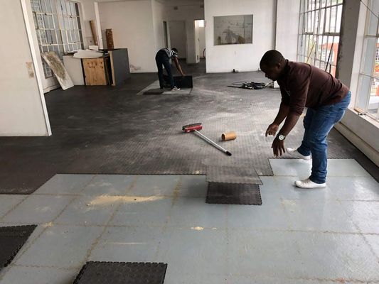 Laying floor tiles at Cape Town Office, 2018