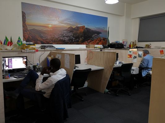 Members at work in front of the Table Mountain mural, 2018